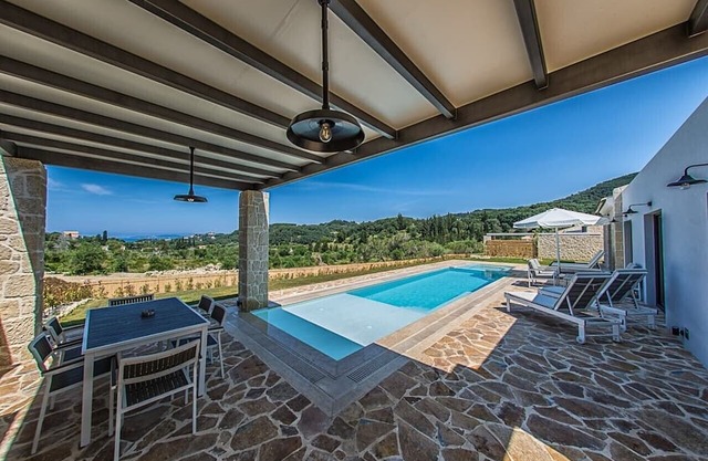 Alluring Corfu Villa | Villa Corallia | 2 Bedrooms | Spacious Furnished Terrace with Shaded Outdoor Dining Area | Private Garden, Pool and Hot Tub | Prime Location | Arillas, Mega Lithari