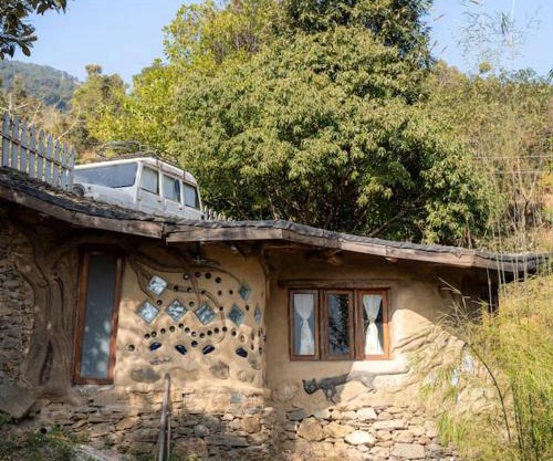 Hidden Earthen Home With An SUV Car As Entrance